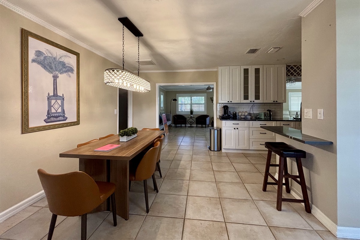 Gather around the table for family meals and games while enjoying the "Old Florida" palm.