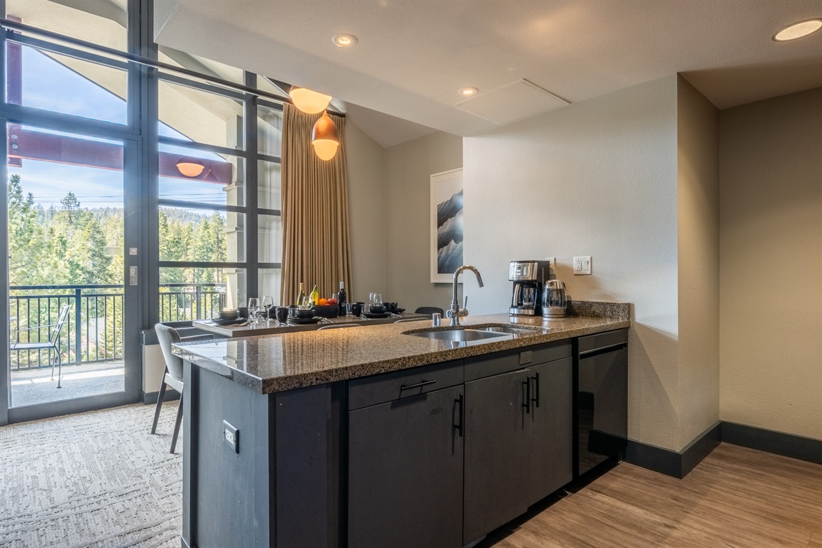 Just off the kitchen and dining area, the first balcony extends the living space outdoors—offering easy access to fresh mountain air and open views toward Mammoth Mountain.