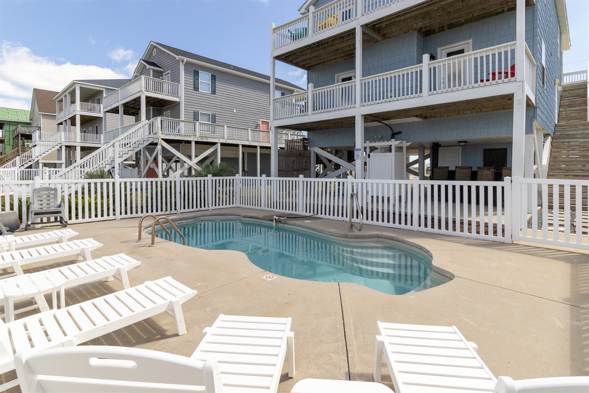 The pool sparkles under the sun