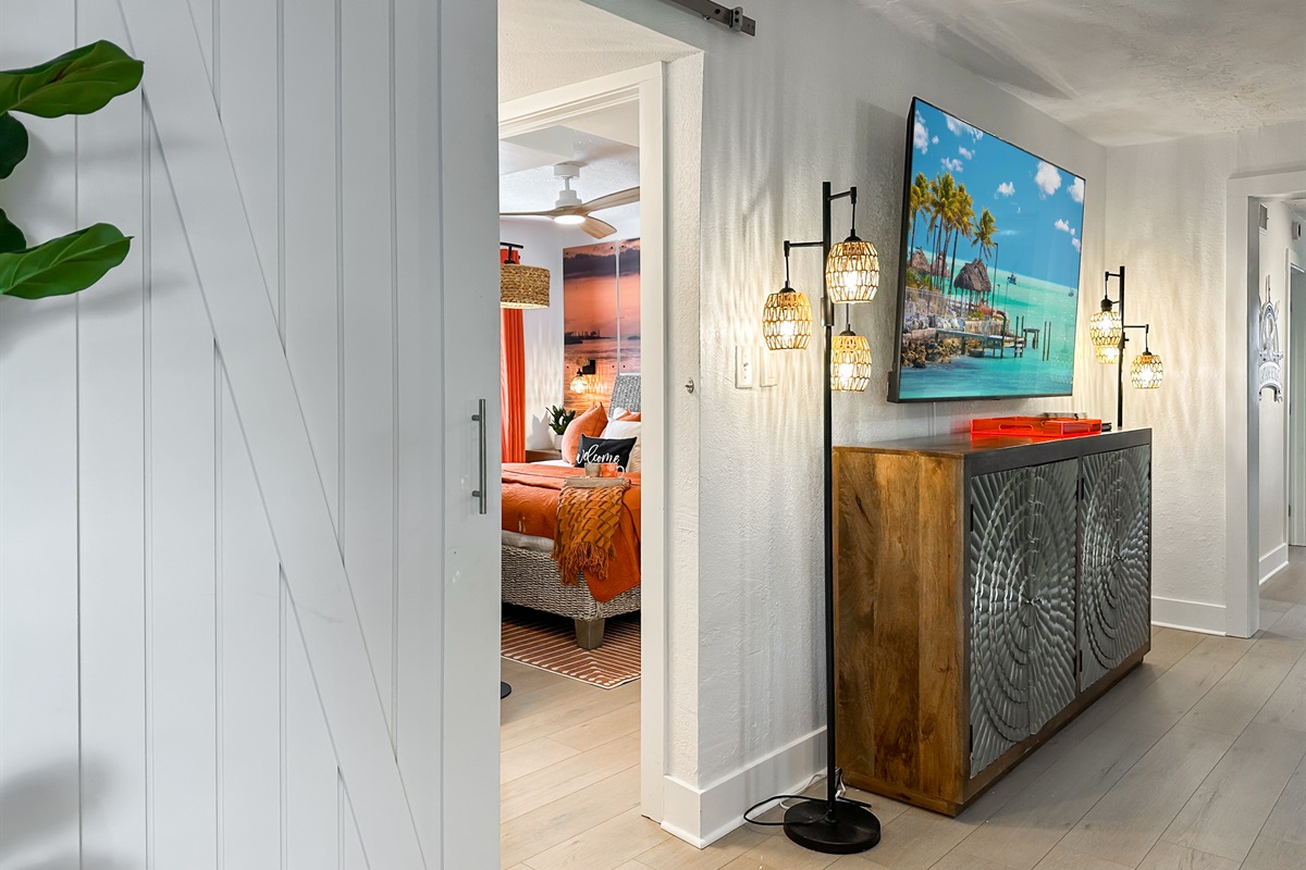 The second bedroom is bedding the living room barn doors.