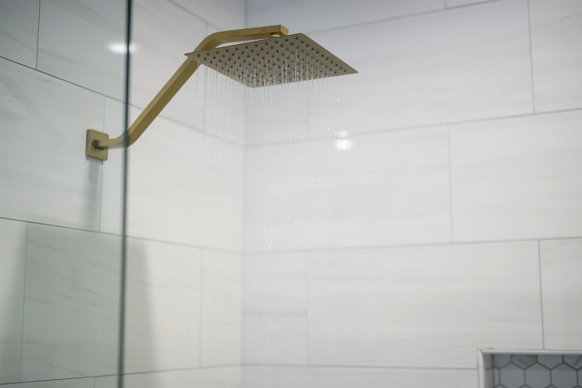 Thoughtful details and upscale fixtures elevate this bathroom into a true retreat.