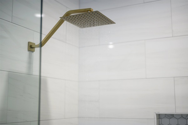 Thoughtful details and upscale fixtures elevate this bathroom into a true retreat.