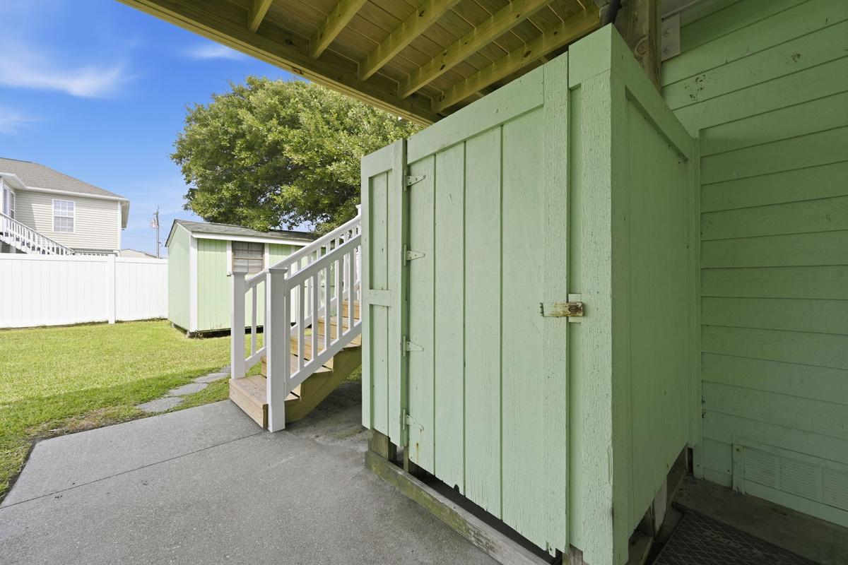 Convenient enclosed outdoor shower, perfect for rinsing off after a day at the beach