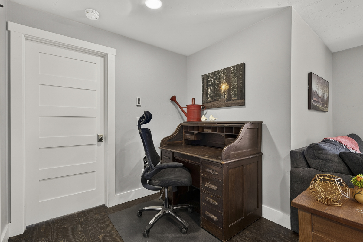 Workspace with desk and chair upstairs.