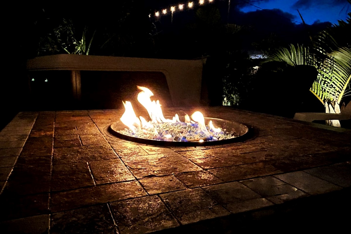 Gas Fire Pit Table, just turn the knob and push the ignitor to start, then pour a night cap and relax with friends and family around the fire