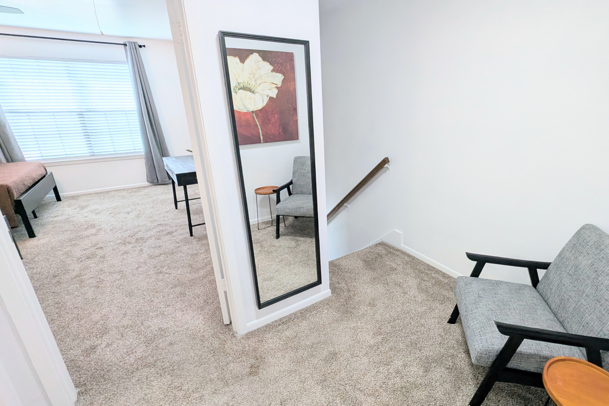 The landing also has a full-length mirror to make getting ready easy. 