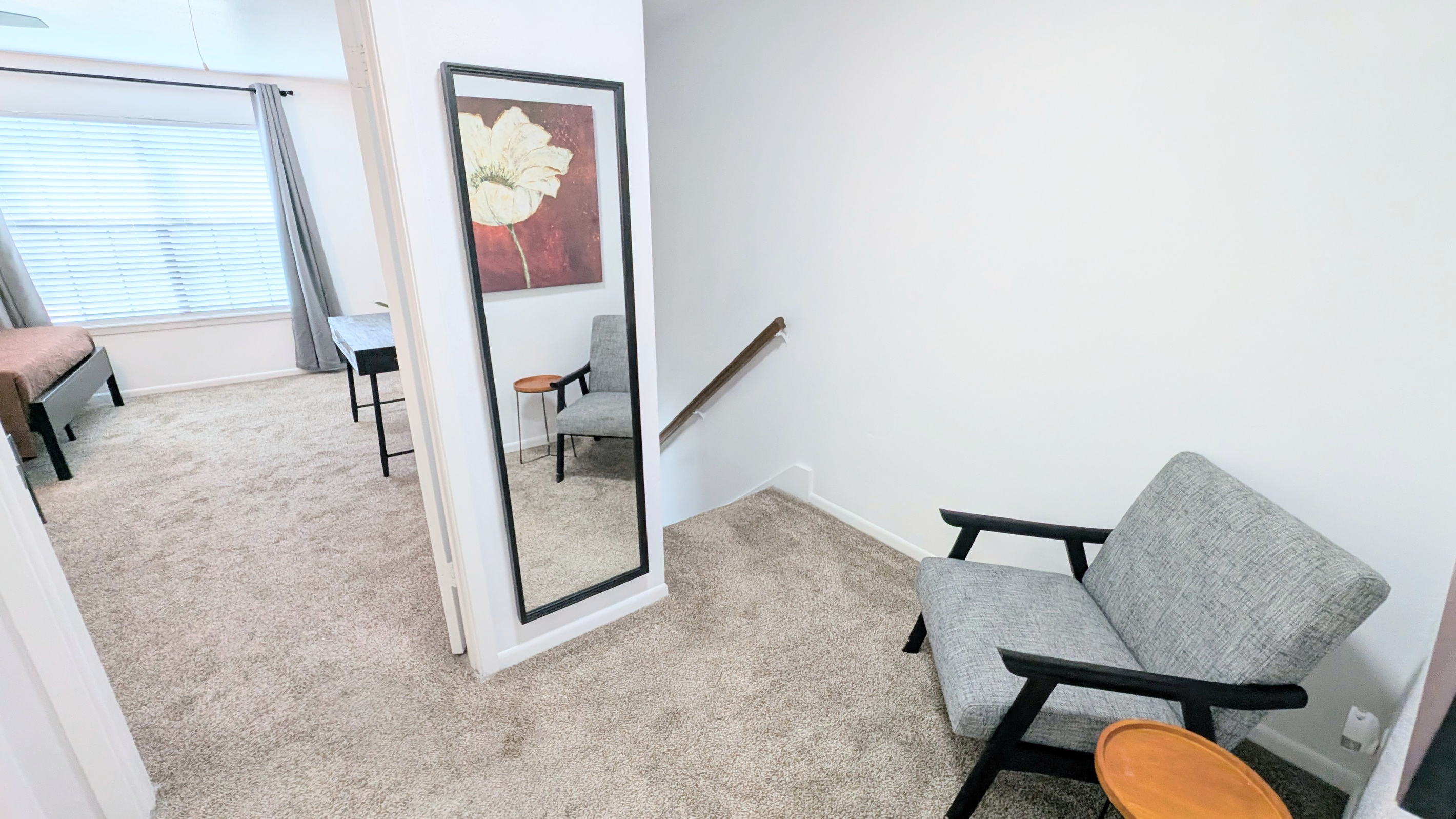 The landing also has a full-length mirror to make getting ready easy. 