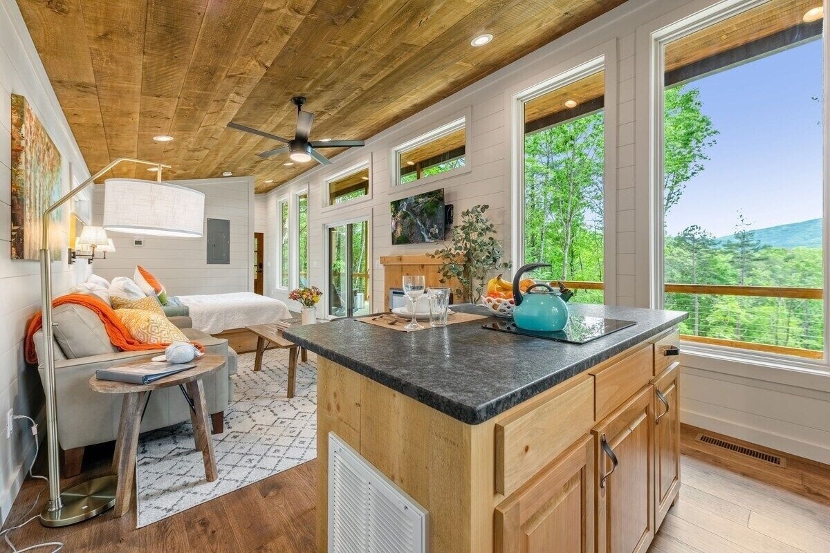 View of inside of cabin and outdoors from the kitchen