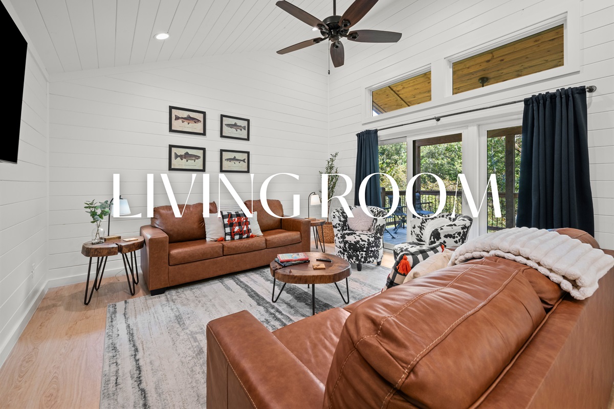 Inviting living room with leather seating and modern decor.