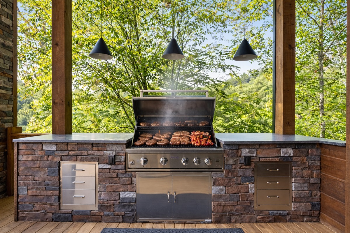 Grill under the open sky, with the trees as your audience.