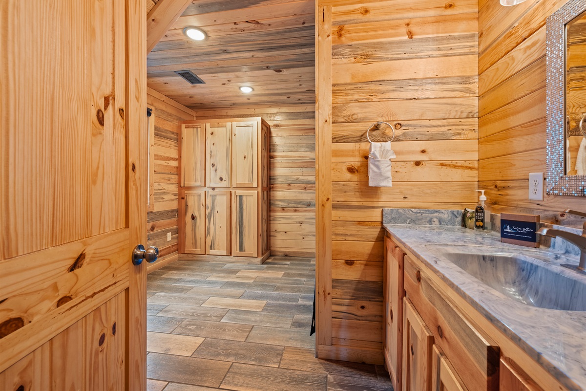 Connecting the rooms throughout the cabin, this hallway keeps the layout feeling open and easy to move through.
