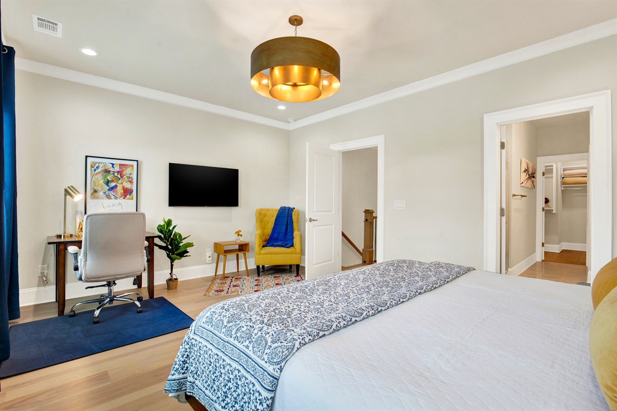 Primary King size bedroom with office space and lounging