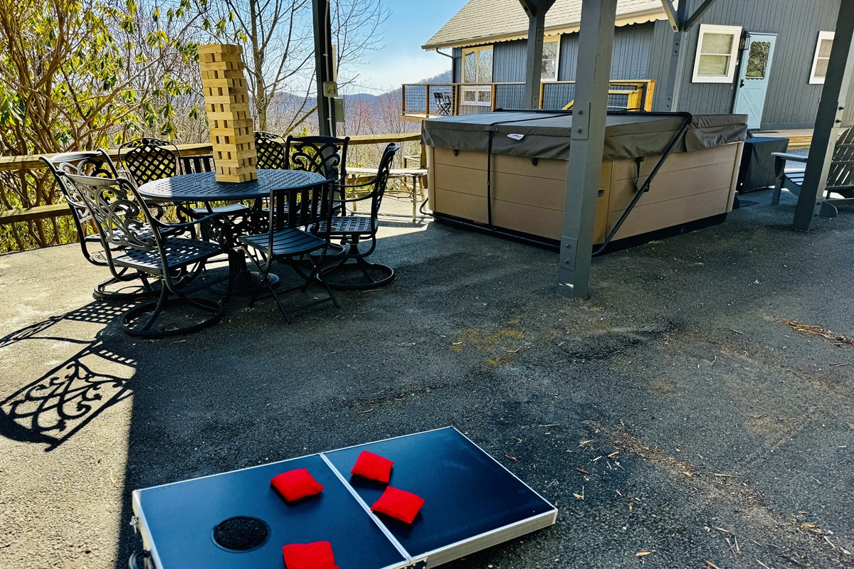 Patio w/ Views: Dining for 6, Big Premium Hot Tub, Fire Pit Table w/ Polywood Adirondack Chairs, a Hammock, extra seating & Outdoor Games. Formerly our carport - there's still room to park 4 cars