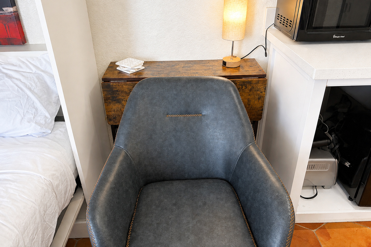 Fold down the desk in half to open up space and watch some TV (mounted on the opposite wall).