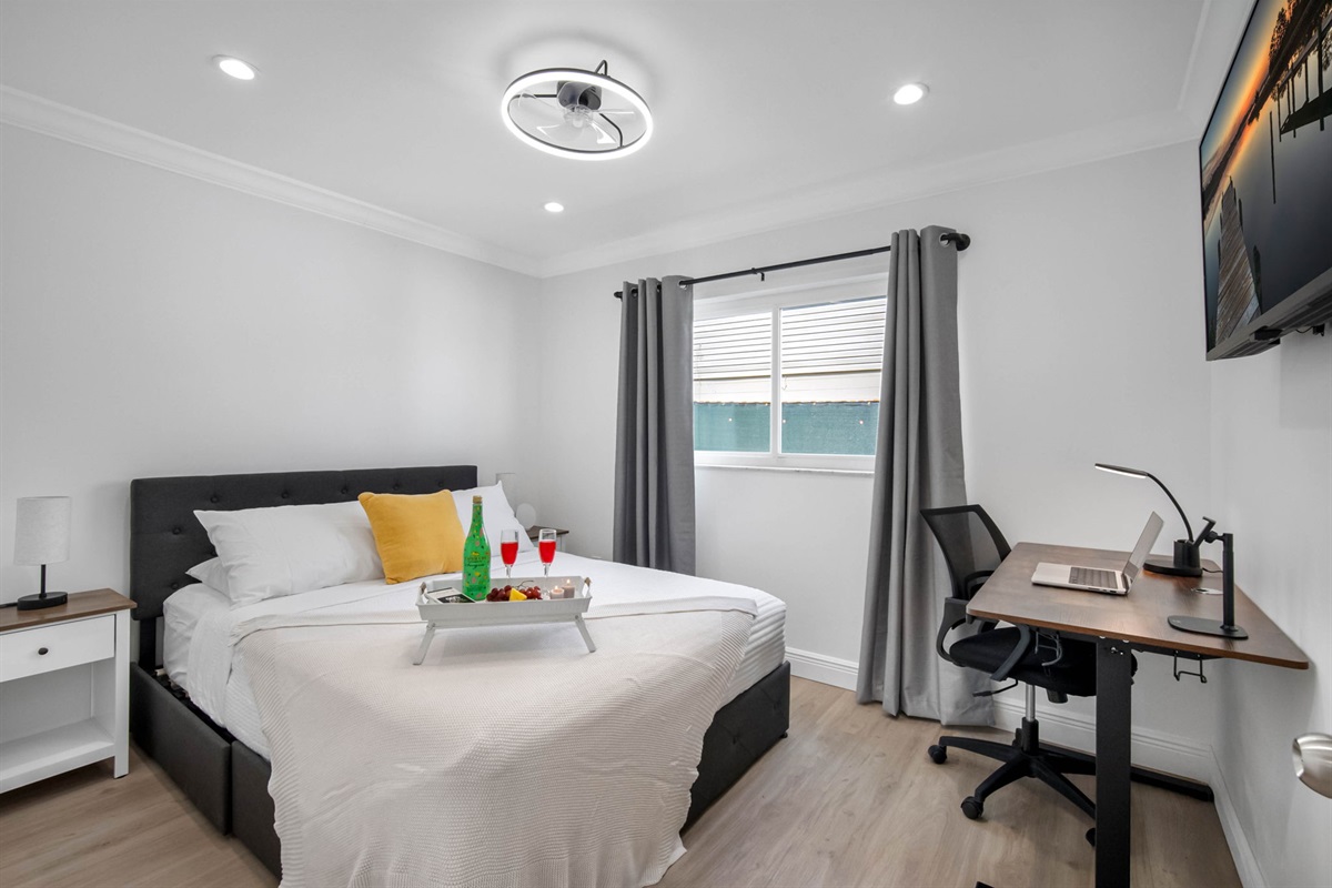 Equipped with a dedicated workspace and comfy bed, this room balances productivity and relaxation beautifully.