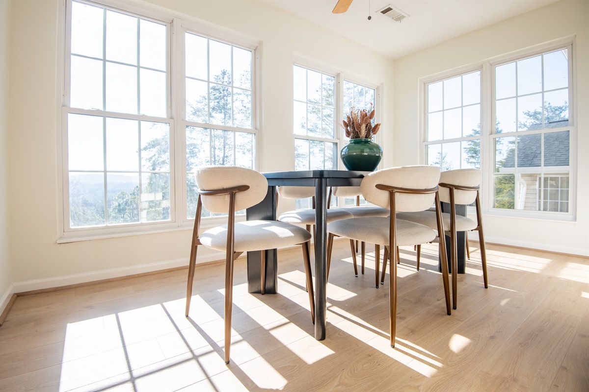 This dining room faces a timeless view of the mountains surrounding you. Enjoy community together over a lovely dinner or a game night while watching the breathtaking sunset!
