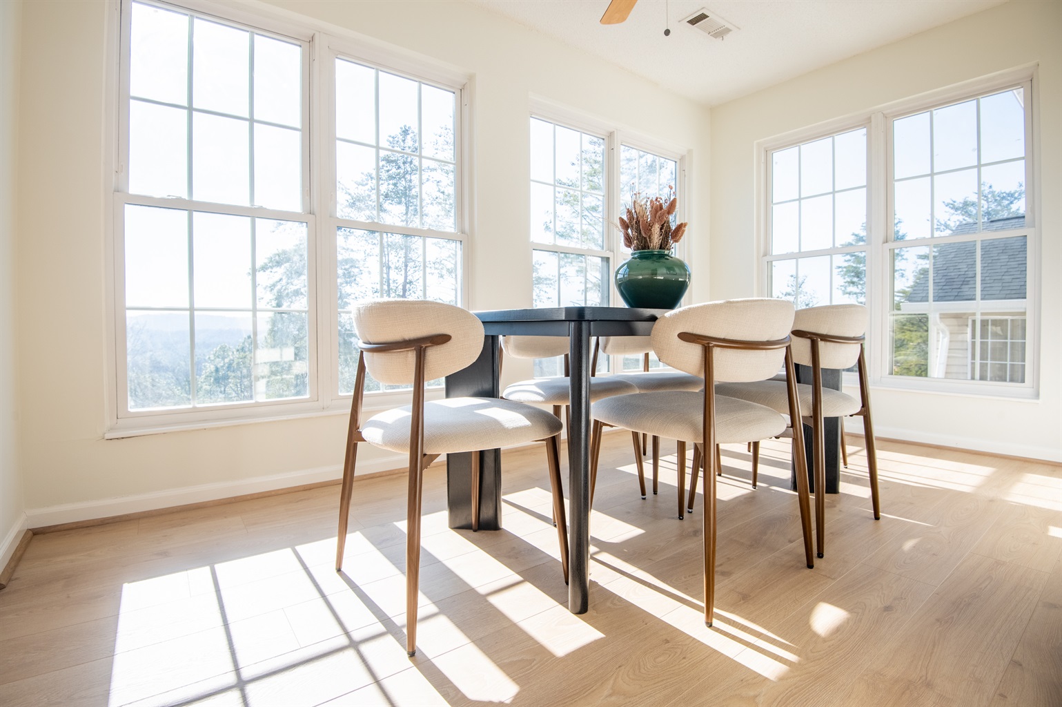 This dining room faces a timeless view of the mountains surrounding you. Enjoy community together over a lovely dinner or a game night while watching the breathtaking sunset!