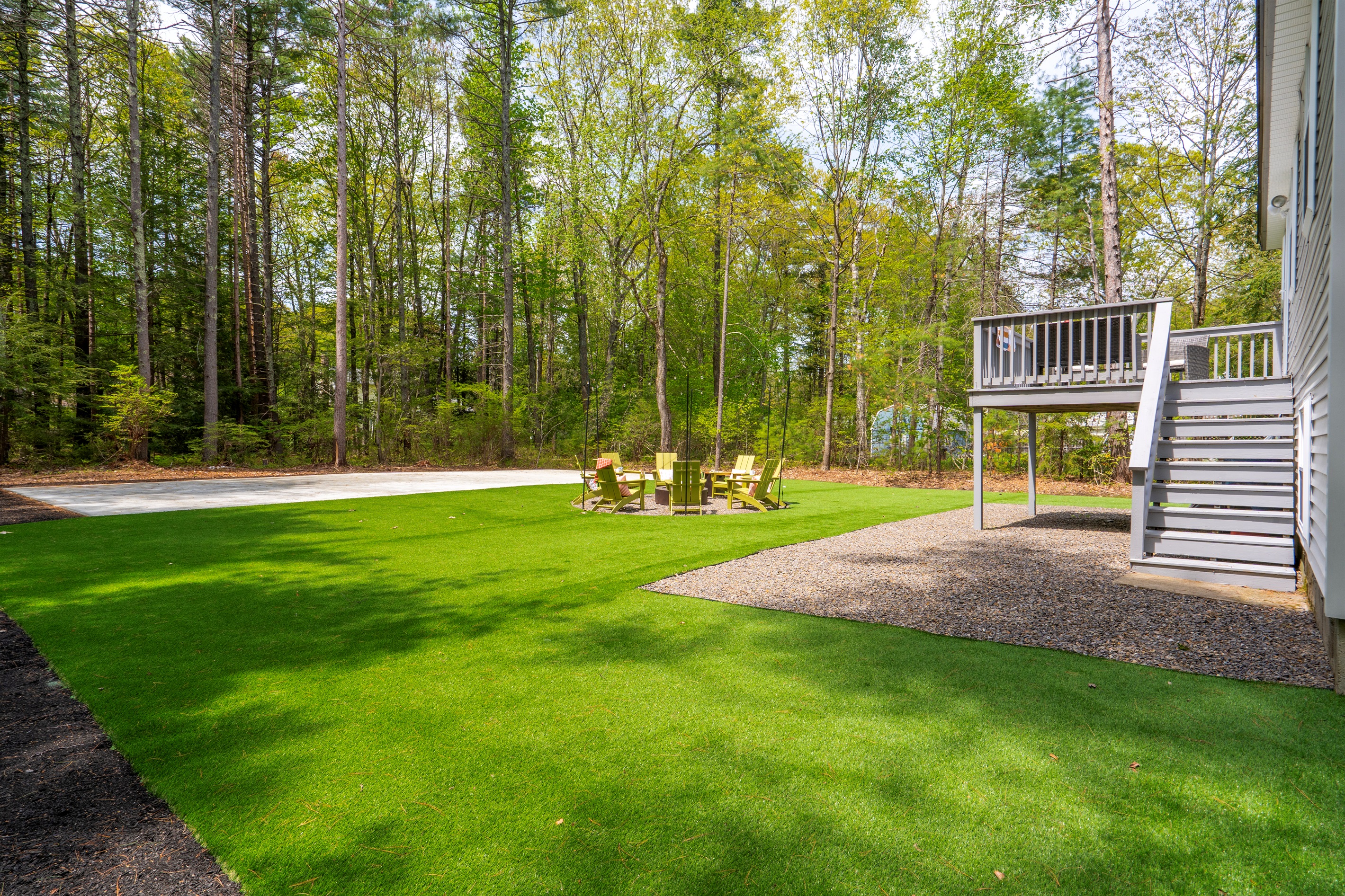 A spacious backyard featuring wide open green space, offering plenty of room for outdoor activities, gatherings, and relaxed time under the open sky.