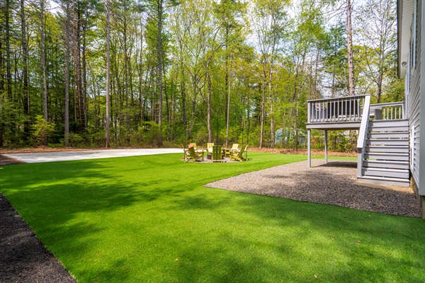 A spacious backyard featuring wide open green space, offering plenty of room for outdoor activities, gatherings, and relaxed time under the open sky.