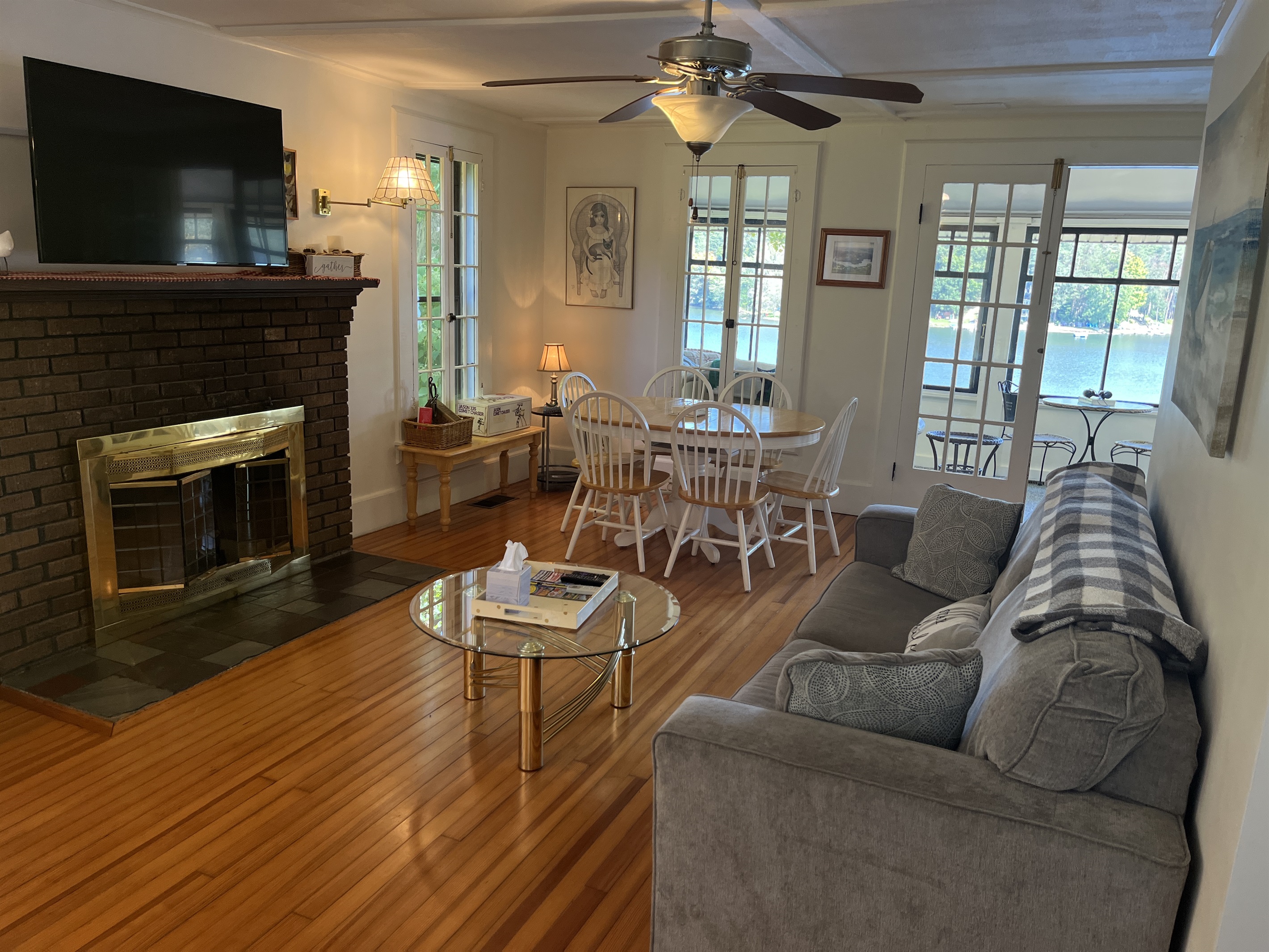 Living room/dining area with sunroom beyond