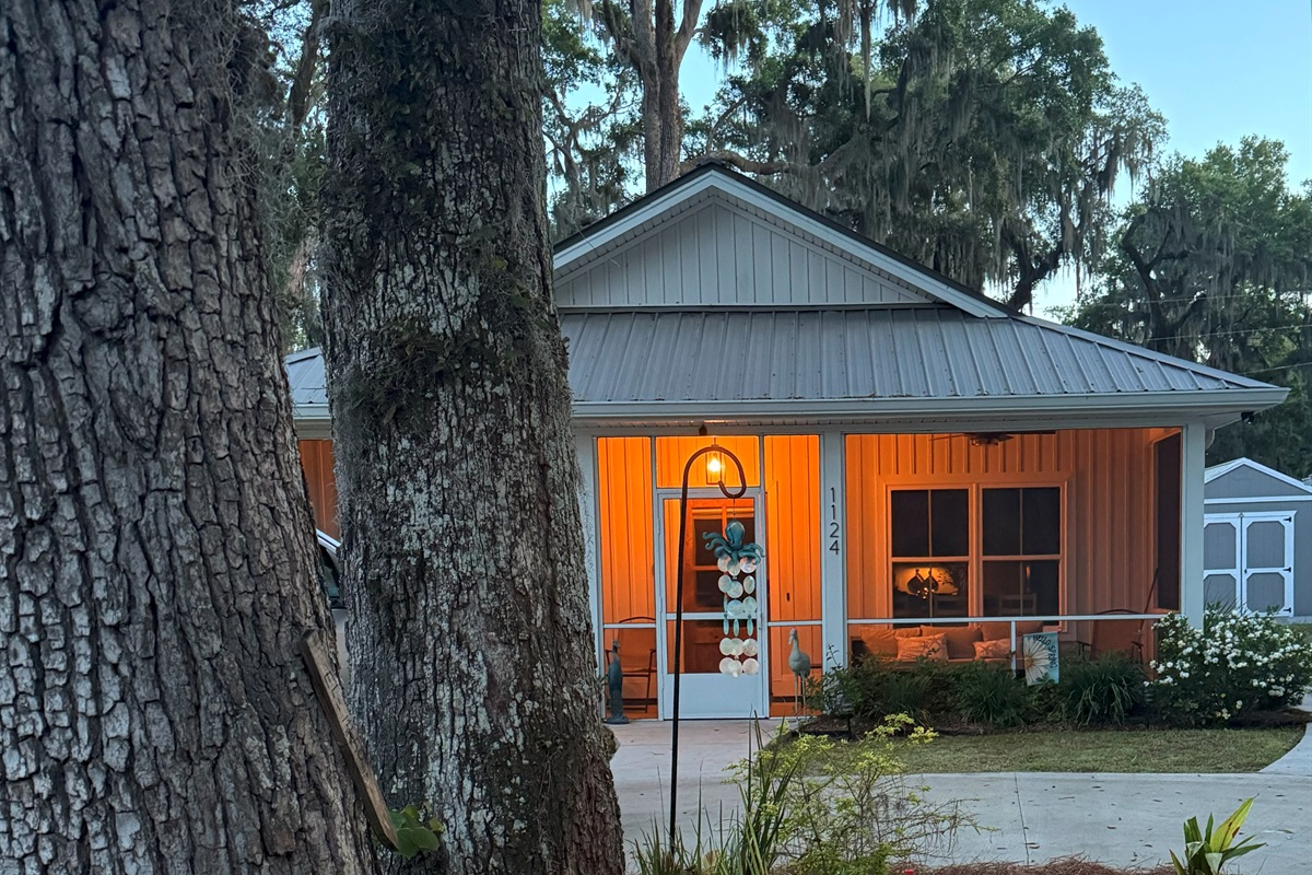 The cottage looks beautiful at dusk!