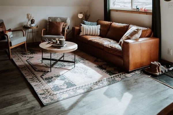 The living room allows for quiet nights and conversation around the record player or smart TV