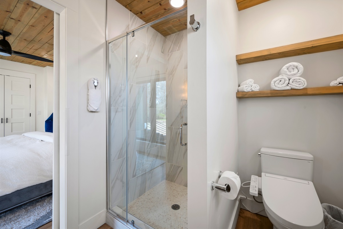 A spacious walk-in shower adds a spa-like touch, offering a refreshing place to start or end your day.