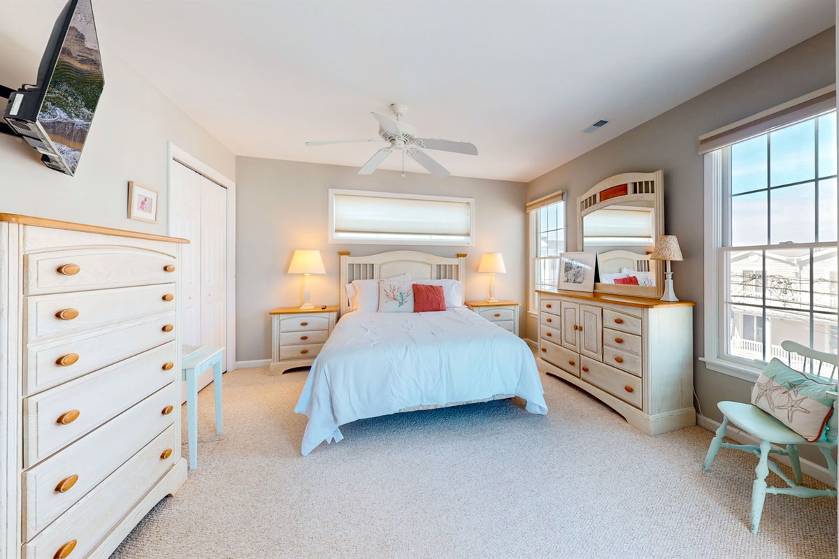 Queen sized bed with a beautiful dresser 