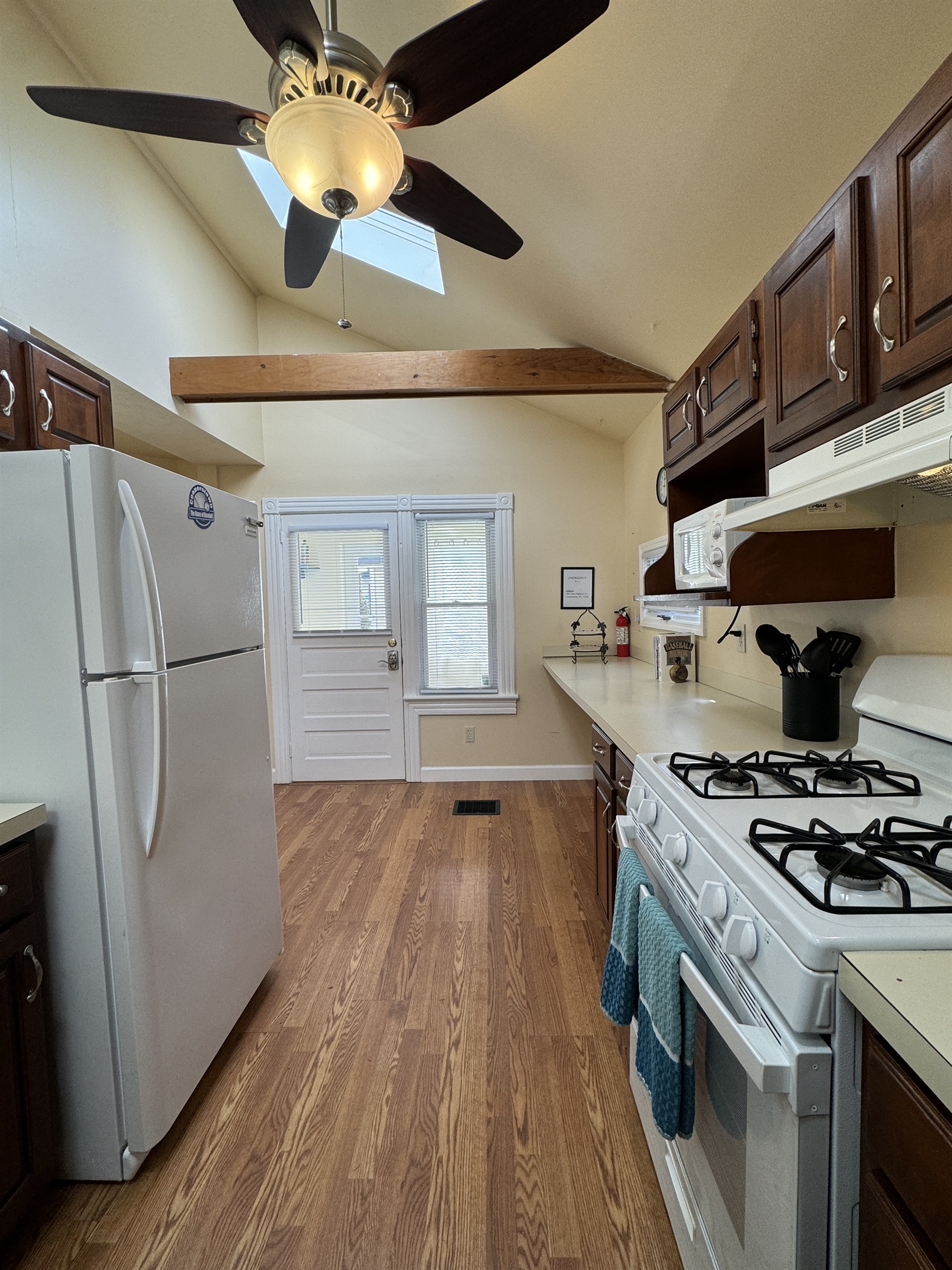 Cooperstown Cottage kitchen view looking to the main entrance and pool access.
