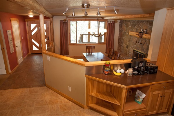 Kitchen looks over the sunken dining room (seats 8)