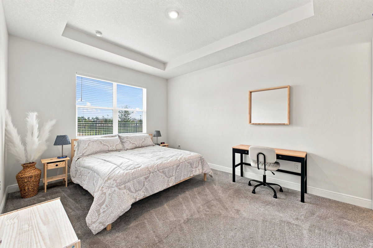 Bright and Airy Bedroom with Vaulted Ceilings 