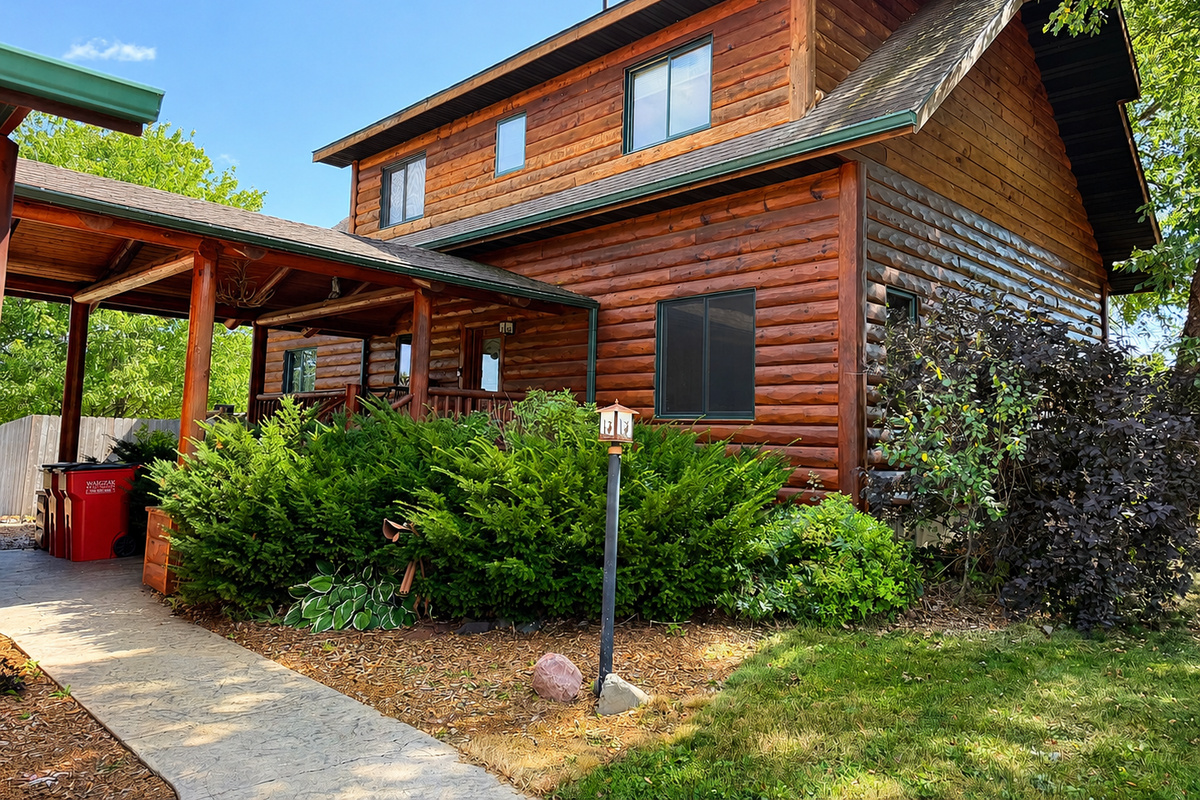Entrance to the house as you walk up to the covered porch give the feel of a classic Northwoods charm from the moment you arrive.
