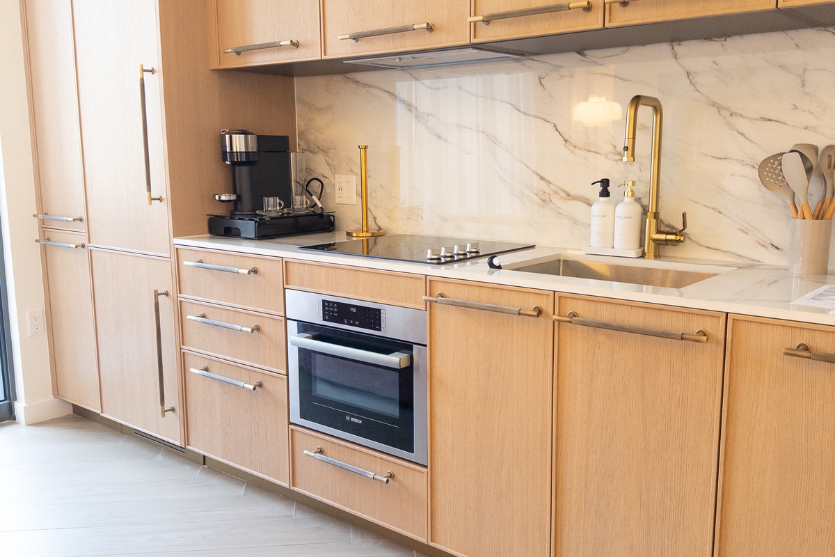 Fully equipped kitchenette &mdash; marble backsplash, cooktop and convection oven