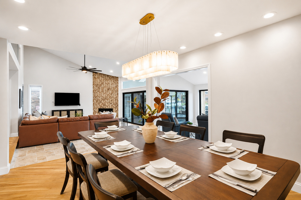 Open-concept dining area with a large table, modern seating, and bright lighting, seamlessly connected to the main living space for entertaining and gatherings.
