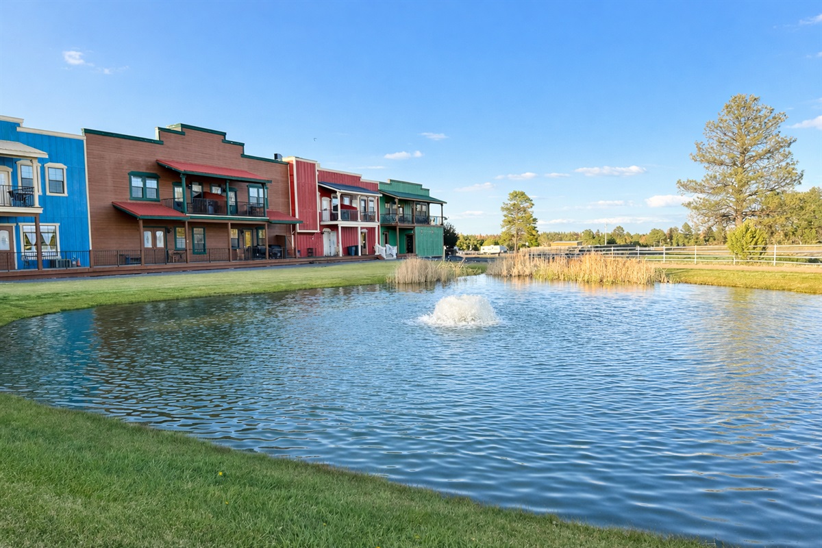 Admire the beautifully manicured landscape and pond, right from the back door!