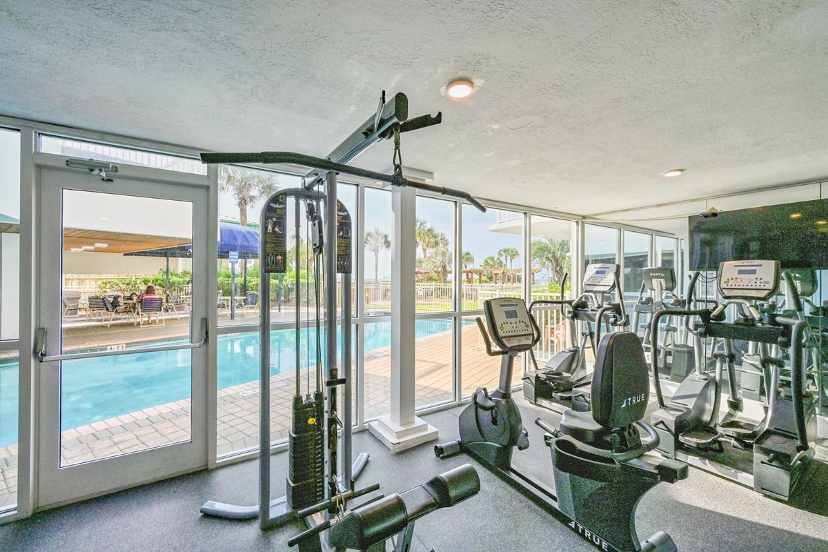 gym with pool view