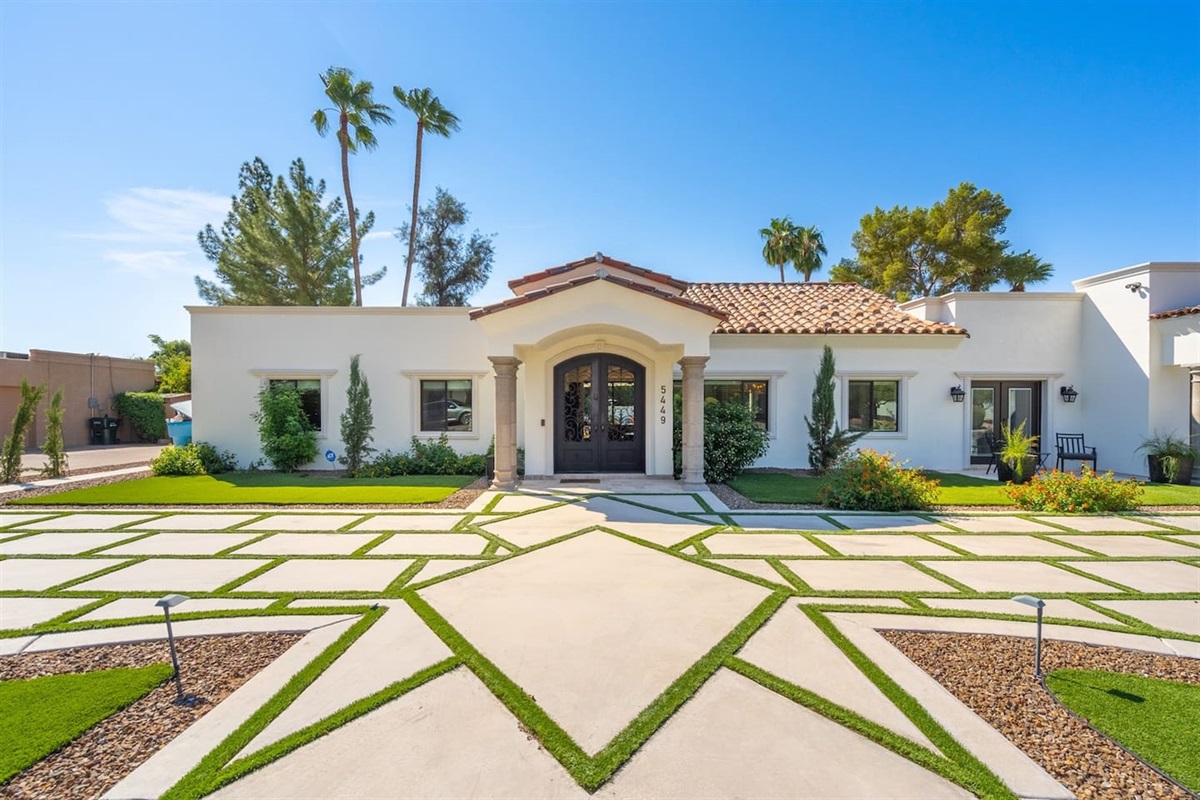 Step into serenity! Our lovely home features a picturesque front view with beautiful landscaping and a welcoming entrance. Enjoy the peaceful surroundings during your stay!