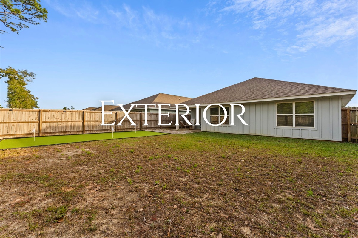 The backyard offers open space to enjoy the fresh air, stretch out, or let kids play while you relax nearby.