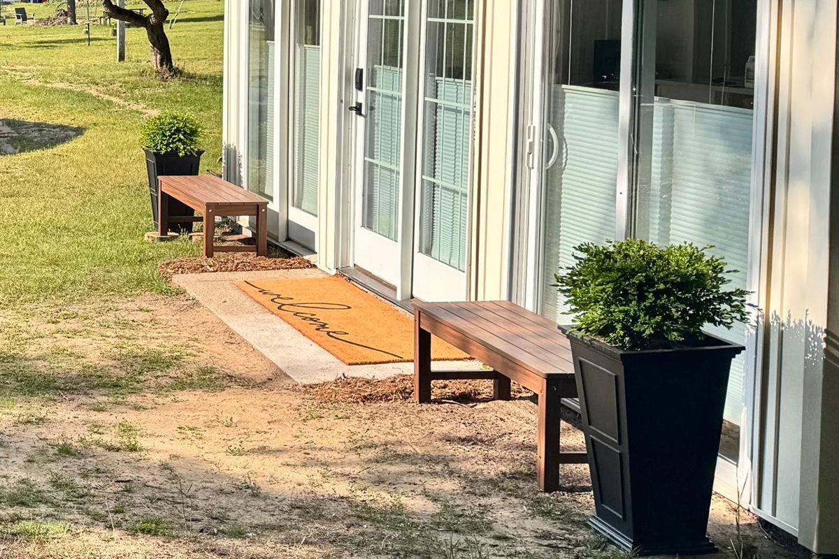 Wake up to beautiful views and golden hour glows. This charming home offers a private, peaceful setting with plenty of natural light and outdoor benches for soaking in the air. Features easy keyless entry for a smooth, contact-free arrival. 