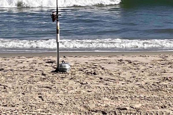 Standing on the beach with toes in the sand and a few lines in the water is a great way to spend a few days in Corolla.