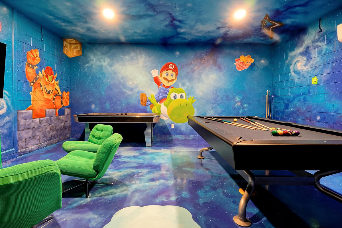 Mario Galaxy Games Room: Immersive games room with a full-size pool table, air hockey and hand-painted Mario murals covering the walls, ceiling and floor.