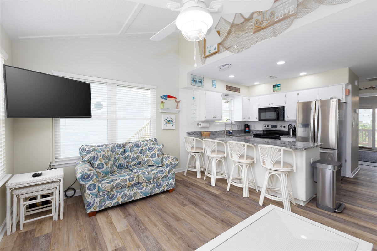 A modern kitchen and comfortable seating