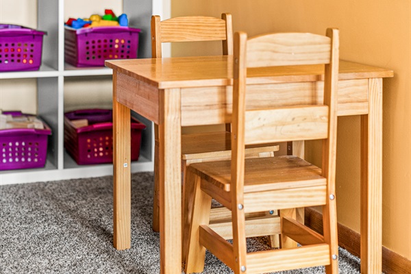A charming nook with a kids' play area, creating a perfect space for little ones to play while adults relax.