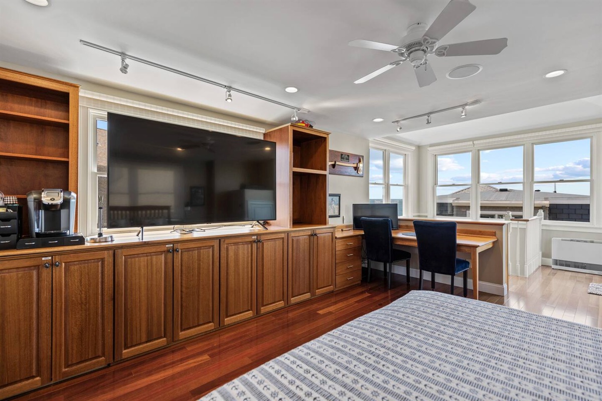 Tv and desk space in guest house