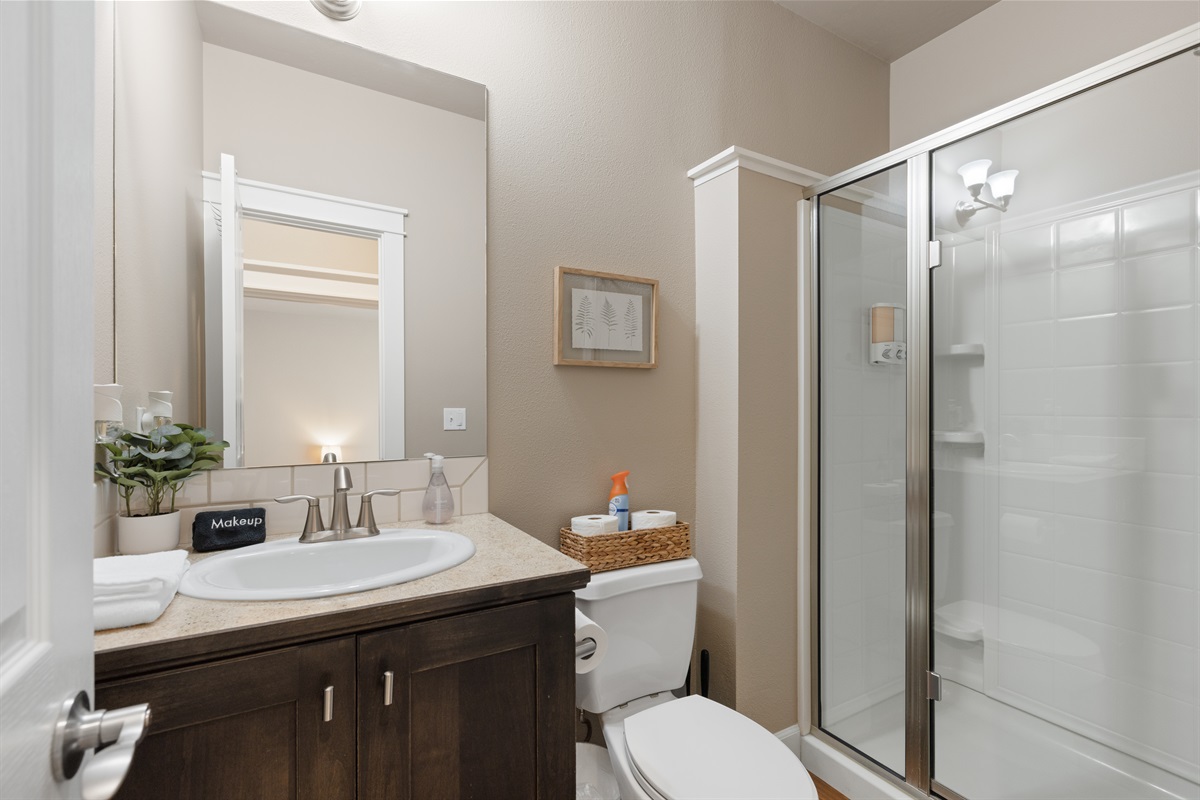 Pristine bathroom with fresh, hotel-style touches.
