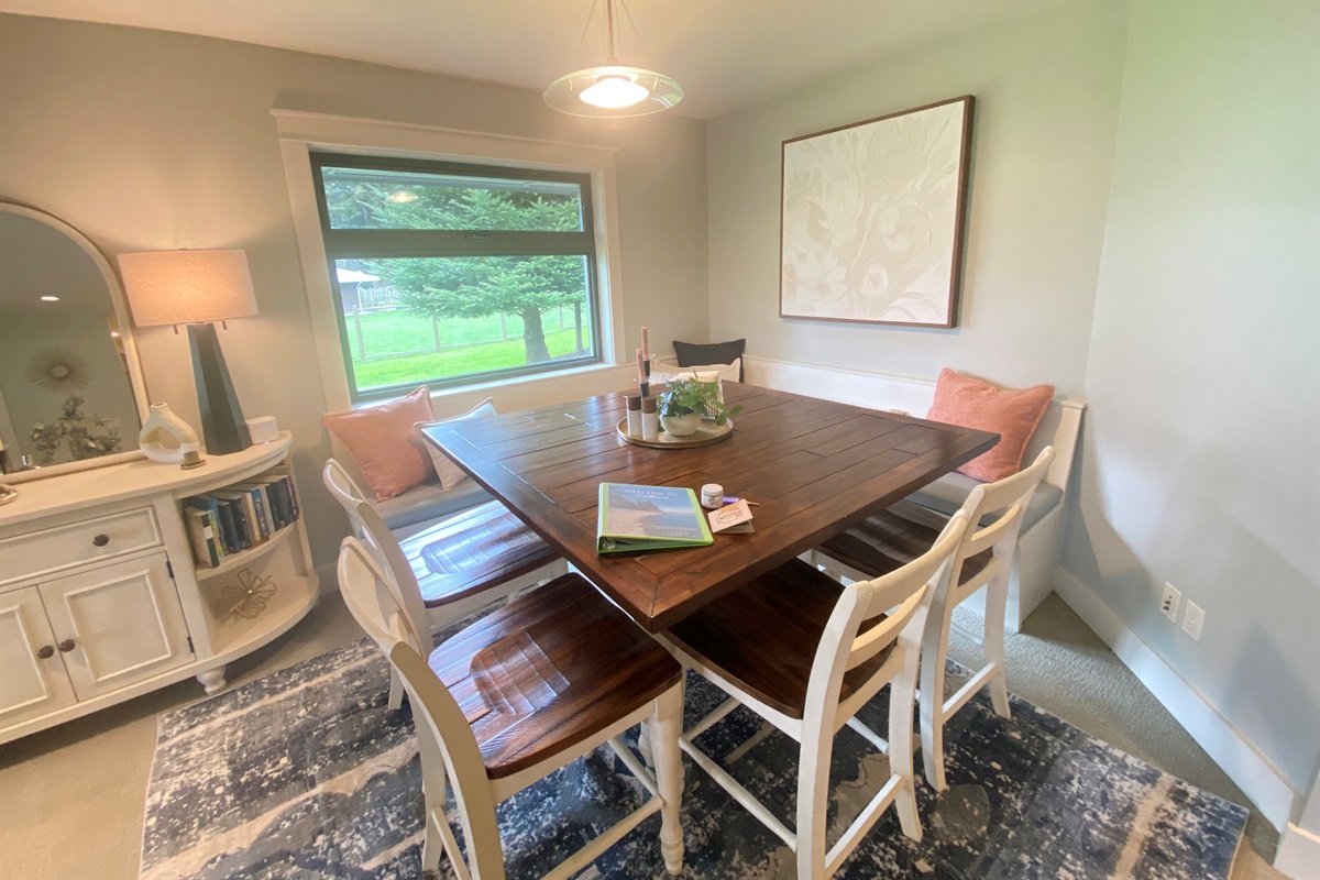 Located across from the kitchen with built-in seating, it’s easy to host visitors and comfortably accommodate dining for eight.