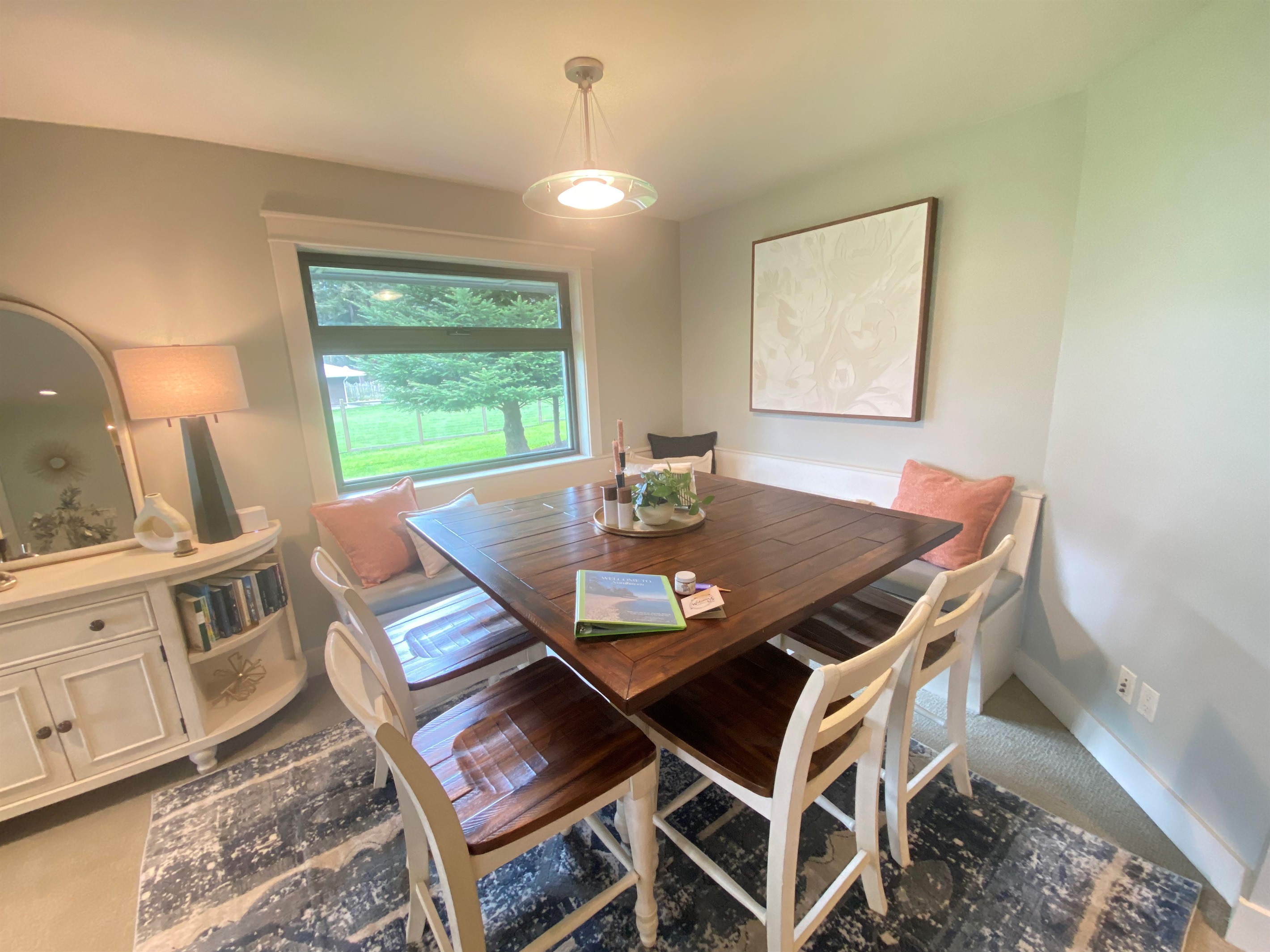 Located across from the kitchen with built-in seating, it’s easy to host visitors and comfortably accommodate dining for eight.