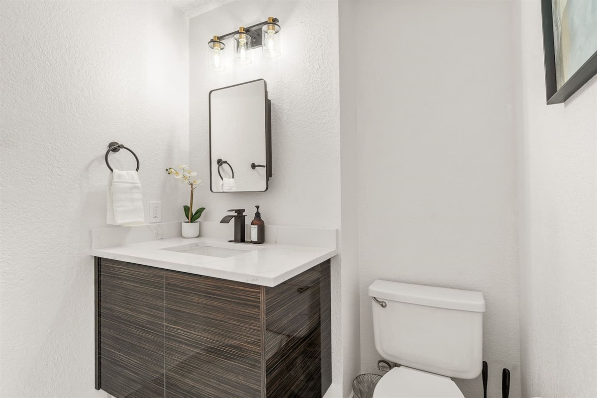 Clean and modern bathroom with updated fixtures and premium bath products.