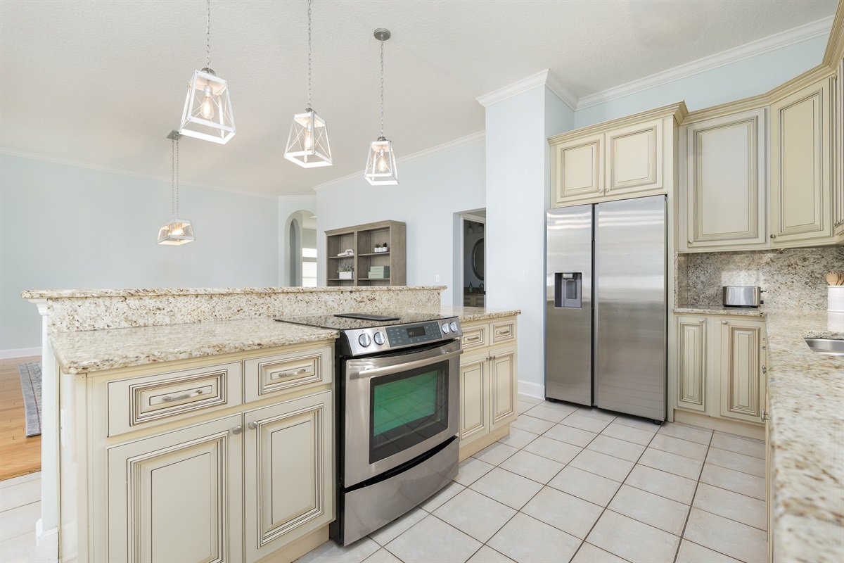 Bright fully equipped kitchen with large island - ideal for family meals and entertaining