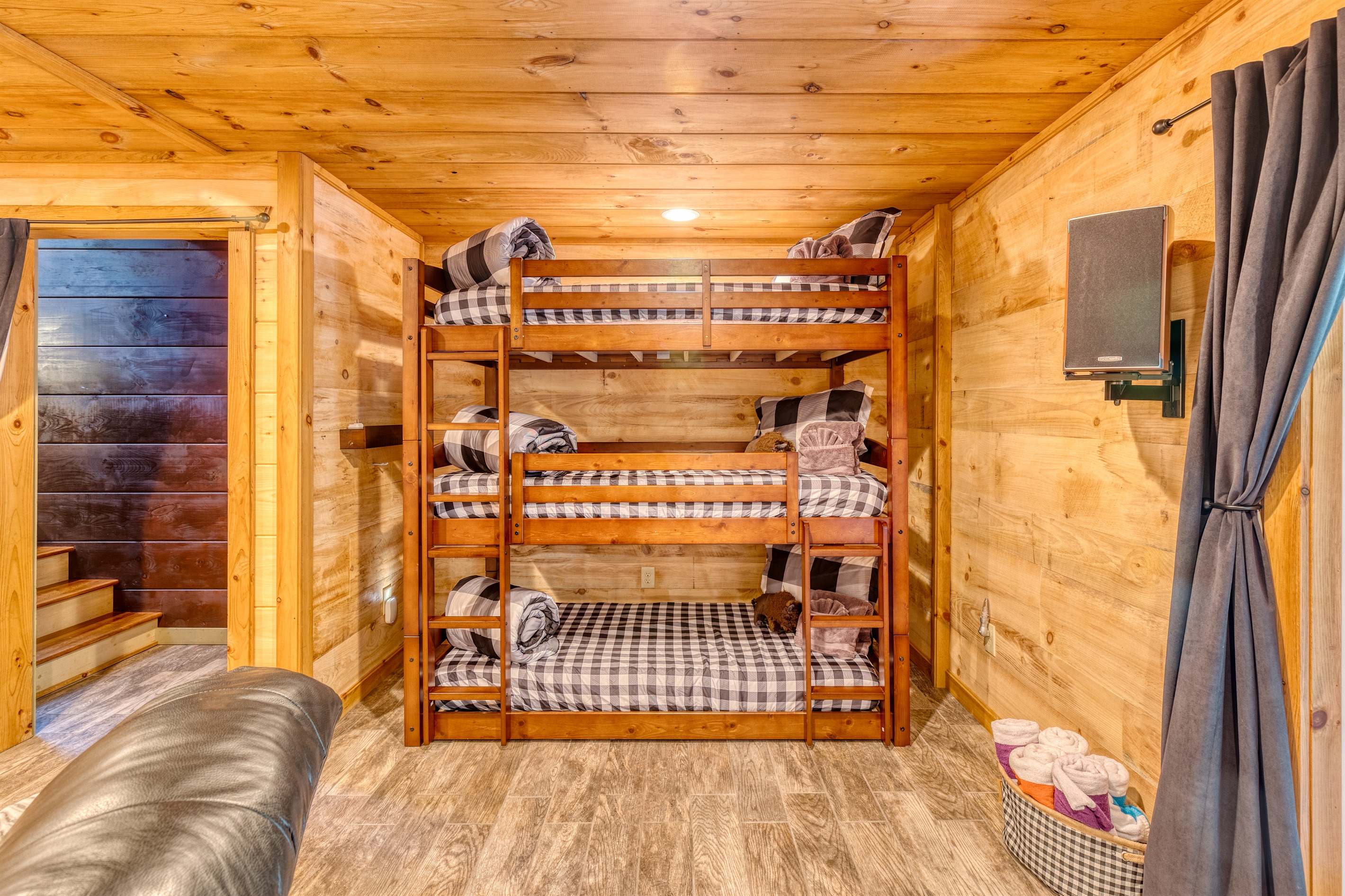 Triple bunk nook located on the lower level.
